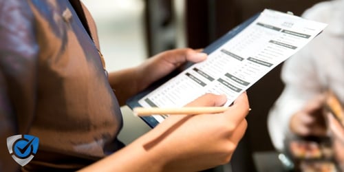 Health Inspector Checking Commercial Cooler Gaskets